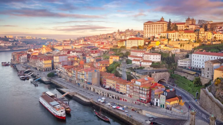 Riverside buildings along the Douro in Porto, Portugal, at sunset