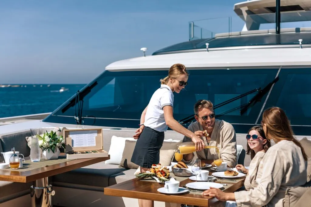 Family enjoying breakfast by the sea