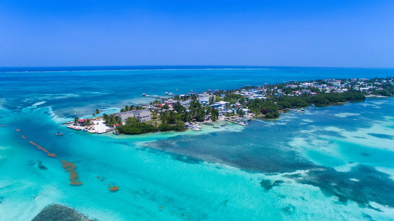 Aerial view of Caye Caulker and the turquoise waters of the Belize Barrier Reef