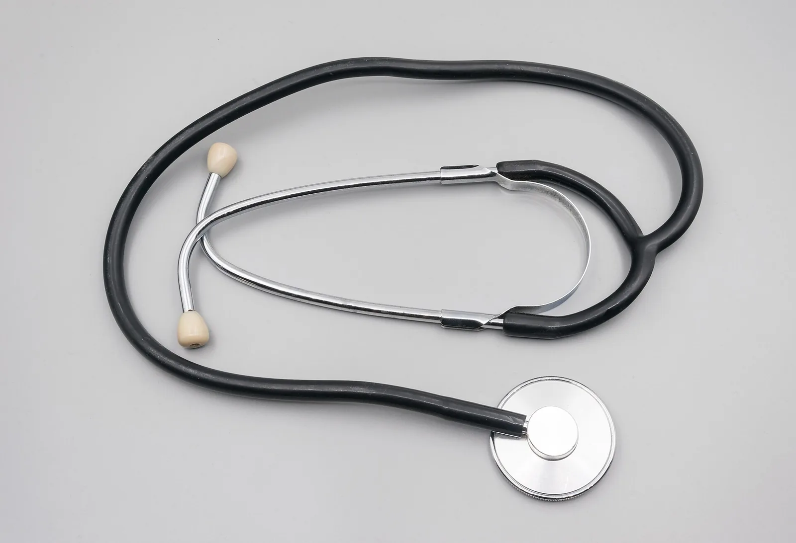 A stethoscope resting on a desk, representing healthcare services